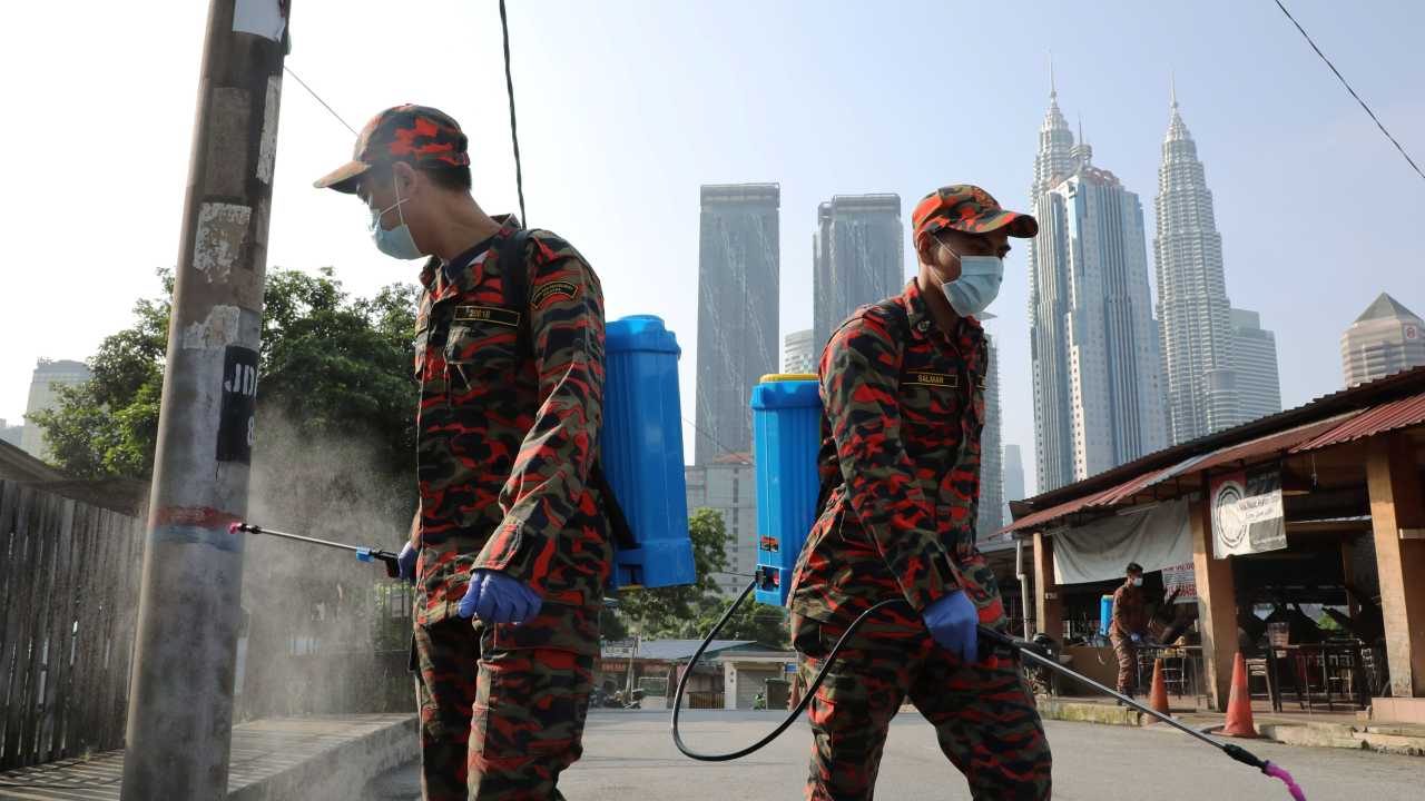 Malaysia to ease lockdown early to stanch economic bleeding