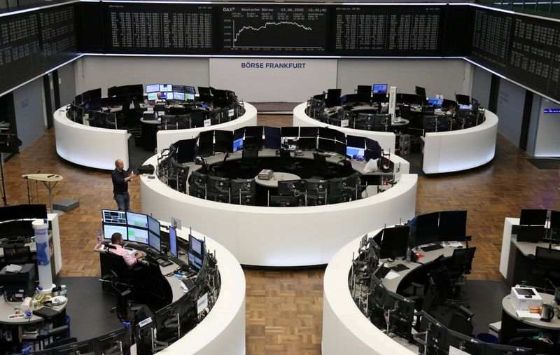 European stocks hit by losses in defensives; chipmakers rise