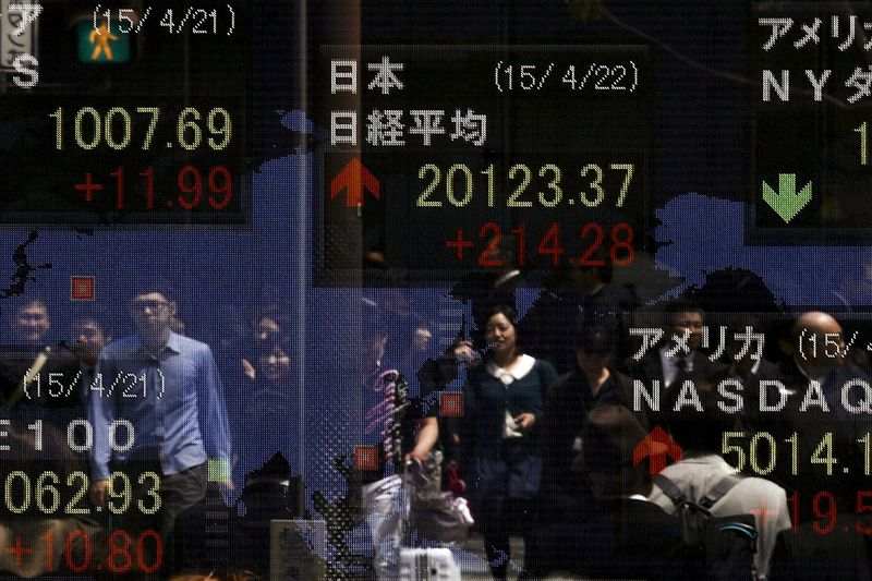 Asian Stocks Up After Boost from Positive U.S. Data, But Headwinds Remain