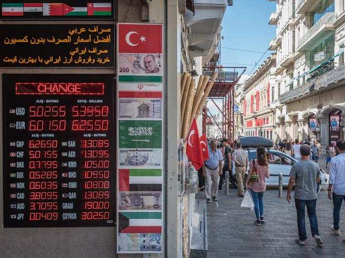 Turkish lira crashes as much as 14% after the firing of the head of the central bank sparks market turmoil